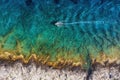 Croatia. Boat at the sea surface. Aerial view of floating boat on blue Adriatic sea at sunny day. Royalty Free Stock Photo