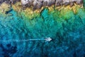 Croatia. Boat at the sea surface. Aerial view of floating boat on blue Adriatic sea at sunny day.