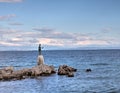 Croatia: Bronze Sculpture/Statue of Maiden with Seagull on Background a Sea in Opatija Royalty Free Stock Photo