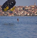 Croatia, Ciovo island - two girls and a boy enjoying sea parachute