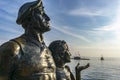 Croatia. Makarska September 2018. A bronze monument to the tourist and a local girl at sunset