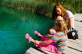 Croatia, Plitvice Lakes. Little girl near the water.