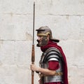 Re-enactors dressed as Roman Legionnaires, wait to pose with Tourists at the gates to the Diocletian Palace