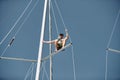 Croatia, Split, 15 September 2019: The sailor costs on the top part of a mast, participant of a sailing regatta with