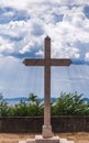 Croatia.Stone cross against the background of the sea and the cloudy sky. Royalty Free Stock Photo