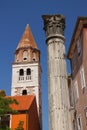Croatia, Zadar - Roman column on the background of the tower of the church of St. Simeon. Royalty Free Stock Photo