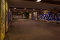 Croatia, Zagreb, June 21, the dark passage of a deserted, eerie creepy concrete indoor pathway grafted with graffiti at night