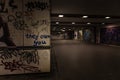 Croatia, Zagreb, June 21, the dark passage of a deserted, eerie creepy concrete indoor pathway grafted with graffiti at night