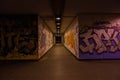 Croatia, Zagreb, June 21, the dark passage of a deserted, eerie creepy concrete indoor pathway grafted with graffiti at night