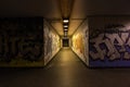 Croatia, Zagreb, June 21, the dark passage of a deserted, eerie creepy concrete indoor pathway grafted with graffiti at night