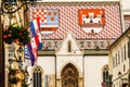The tile roof of Saint Mark`s Church displays the coat of arms of Zagreb and the Triune Kingdom of Croatia, Slavonia and Dalmatia Royalty Free Stock Photo