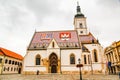 The tile roof of Saint Mark`s Church displays the coat of arms of Zagreb and the Triune Kingdom of Croatia, Slavonia and Dalmatia Royalty Free Stock Photo