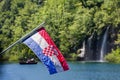 Croatian flag waved over Plitvice Lake National Park, Croatia