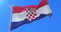 Croatia flag waving at wind with blue sky, loop
