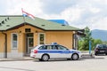 Croatian Police Vehicle Patrols the Borders Between Croatia and Slovenia. Parked Outside a Traditional Police Station