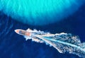 Croatian seascape with boat. Yachts at the sea surface. Aerial view of luxury floating boat on blue Adriatic sea at sunny day.