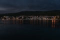 Croatian coast town Selce illuminated at dusk.