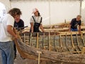 Croatian traditional shipbuilders are working on the restoration of an old wooden boat