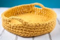 Crochet basket made of yellow thread Royalty Free Stock Photo