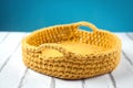 Crochet basket made of yellow thread Royalty Free Stock Photo