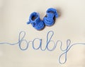 Crochet Blue Baby Booties on gray background Royalty Free Stock Photo