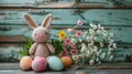 Crochet Bunny with Painted Easter Eggs and Spring Flowers. Royalty Free Stock Photo