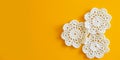 Crochet doilies on a yellow background