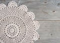 Crochet doily over old grey wood