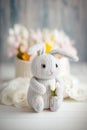 Crochet Easter bunny. Amigurumi pastel colors Easter rabbit and gentle spring flowers. Knitting concept. International