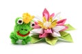 crochet frog king with crown and origami water lily on white background. tinker. Royalty Free Stock Photo