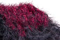 Crochet fun fur black and metallic red scarf with a striped pattern.