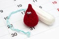Crochet funny blood drop, Menstruation sanitary soft cotton white tampon and calendar. Woman critical days, gynecological menstrua Royalty Free Stock Photo