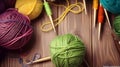 Crochet and knitting hobby. Colorful balls of yarn, knitting needles on table, with copy space, flat lay, and wood background