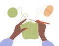 Crochet knitting process. African female hands with hook and thread. Balls of yarn. Top view of the workplace. Tailor Royalty Free Stock Photo