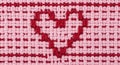 A crochet pattern featuring a heart design. Made with interwoven pink and red yarns, the Royalty Free Stock Photo
