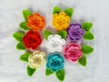 Crochet pattern flowers rose with leaves background texture