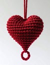 Crochet Red Heart Ornament with Hanging String on White Background Royalty Free Stock Photo