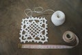 Crochet sample for tablecloth or napkin with meter.