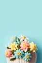 Crochet spring flowers on light blue background with copy space for Mother's day, Easter, Woman's day, 8 March
