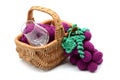 Crochet wine grapes in basket with vine glass on white isolated Royalty Free Stock Photo