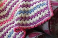 Crocheted blanket on chaise Royalty Free Stock Photo