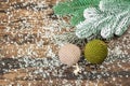 Crocheted Christmas balls and holiday decor. Snow-covered fir tree branches Royalty Free Stock Photo