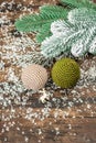 Crocheted Christmas balls and holiday decor. Snow-covered fir tree branches Royalty Free Stock Photo