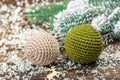 Crocheted Christmas balls and holiday decor. Snow-covered fir tree branches Royalty Free Stock Photo