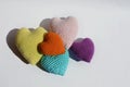 crocheted colored heart on a white background. yarn, cotton, handmade creativity. valentine\'s day. love.