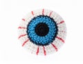 Crocheted Eye Ball Toy with Blue Iris and White Background in Studio Lighting Royalty Free Stock Photo