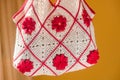 Crocheted handbag with red flowers Royalty Free Stock Photo