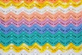 Crocheted multicolored cotton fabric In summer colors. Striped w