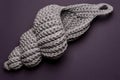 Crocheted shell on a purple background, handmade Royalty Free Stock Photo