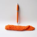 Bright Orange Knitted Pen In Empty White Space